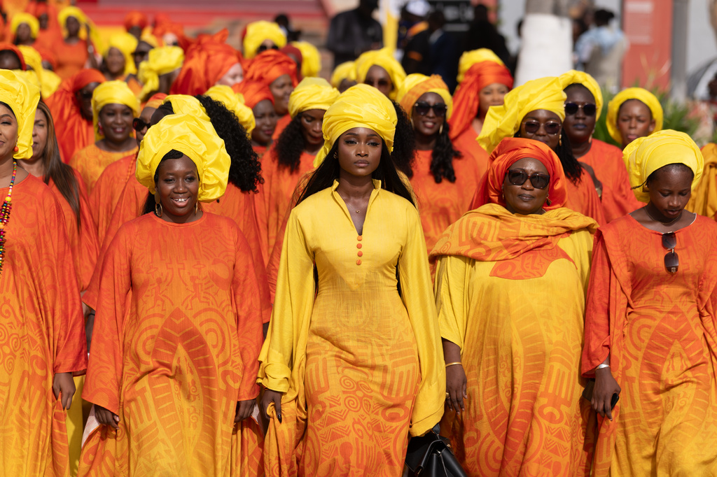 Women take part in a procession during an Olympic torch lighting ceremony, ahead of the Dakar 2026 Youth Olympic Games, in Dakar, Senegal, Saturday, Sept. 12, 2026. (AP Photo/Sylvain Cherkaoui)