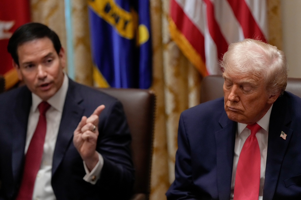 President Donald Trump closes his eyes as Secretary of State Marco Rubio speaks during a Cabinet meeting at the White House, Tuesday, Dec. 2, 2025, in Washington. (AP Photo/Julia Demaree Nikhinson)