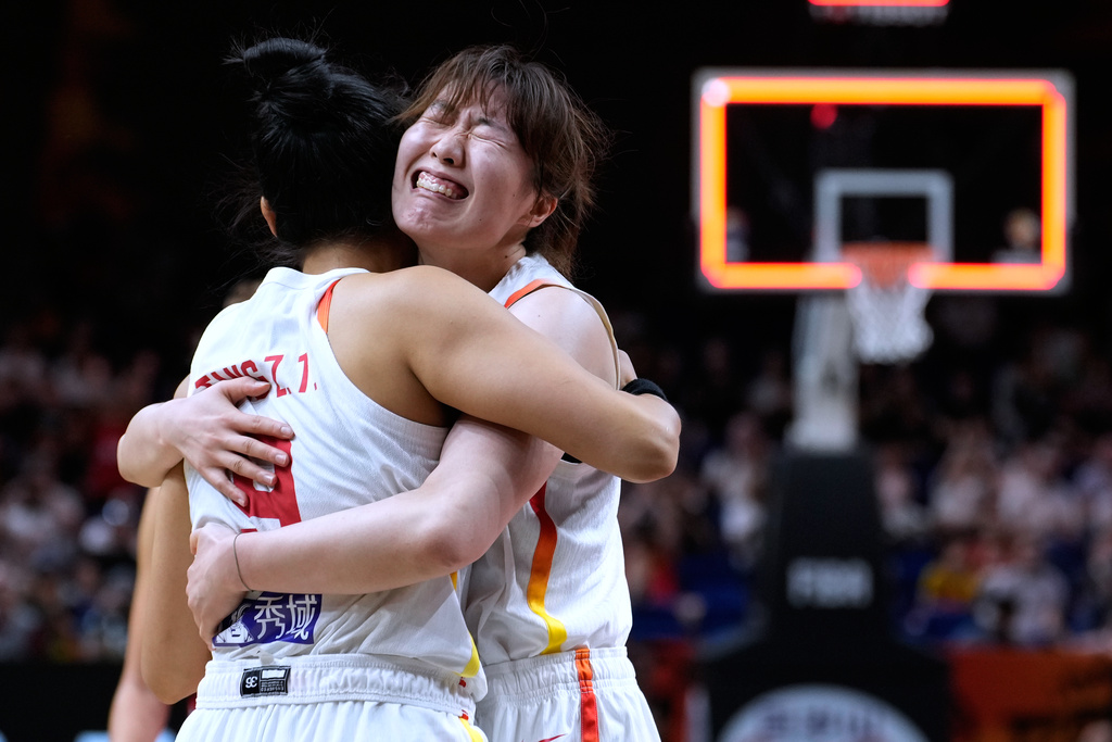 China's Tang Ziting, left, and Luo Xinyu celebrate after the Women's Basketball World Cup match between Czechia and China in Berlin, Sunday, Sept. 6, 2026. (AP Photo/Ebrahim Noroozi)