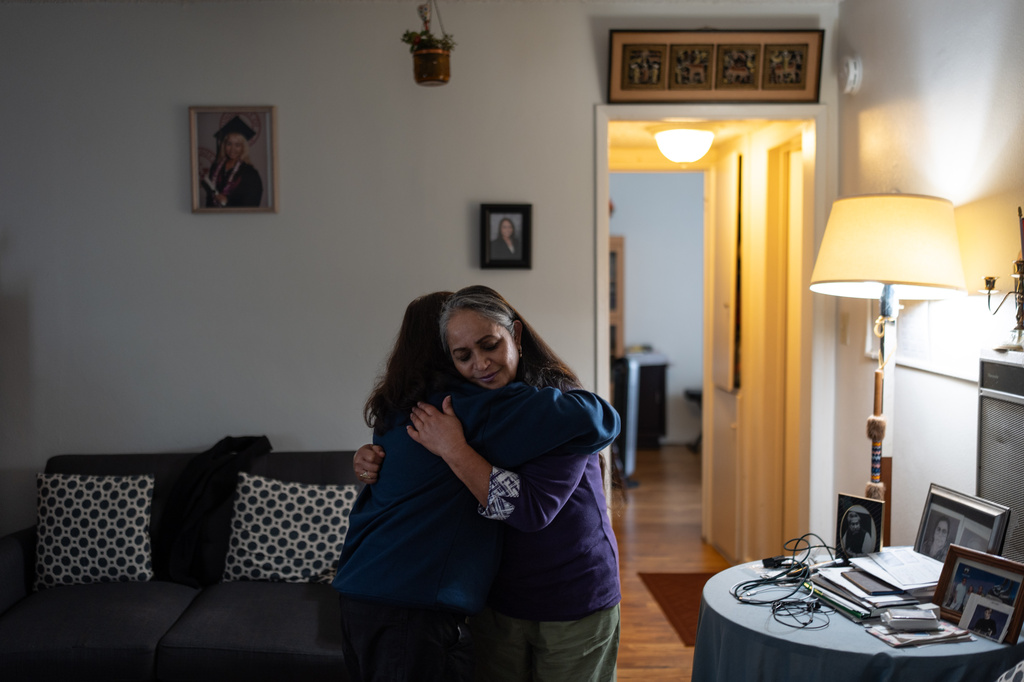 Masuma Khan, right, an immigrant from Bangladesh who was held at an immigration detention facility in California City the previous year, hugs her daughter, Riya, after an interview with a news outlet in Altadena, Calif., April 21, 2026. (AP Photo/Jae C. Hong)