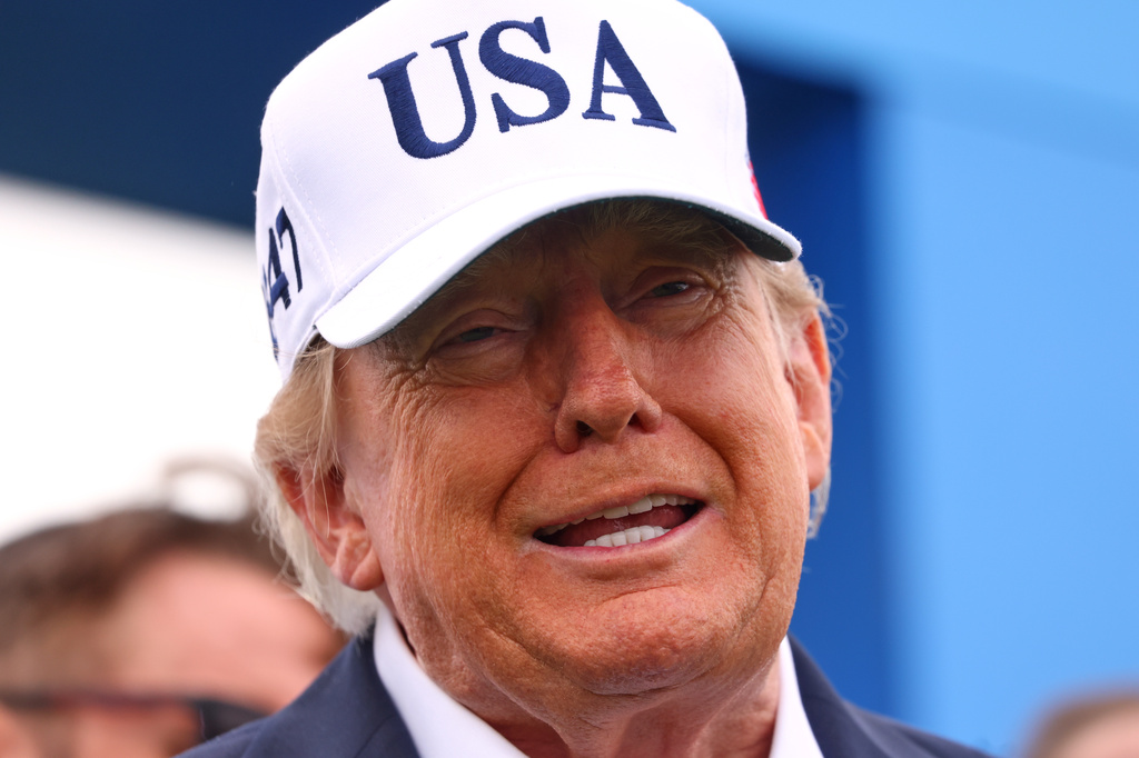 U.S. President Donald Trump arrives at the first tee during the Irish Open at the Trump International Golf Links course in Doonbeg, Ireland, Sunday, Sept. 13, 2026.(AP Photo/Peter Morrison)