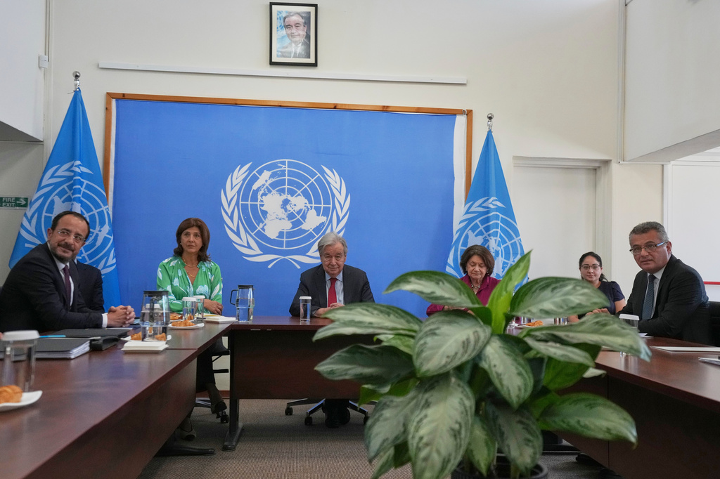 Cyprus President Nikos Christodoulides , left, United Nations Secretary-General Antonio Guterres, center, and Turkish Cypriot leader Tufan Erhurman, right, meet at a U.N. compound in the Nicosia airport area, inside the United Nations-controlled buffer zone in the divided capital of Nicosia, Cyprus, Wednesday, July 29, 2026. (AP Photo/Petros Karadjias, Pool)