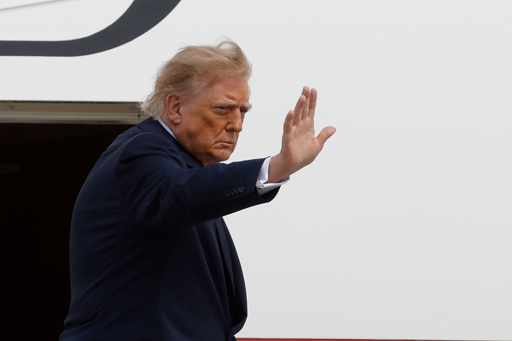 President Donald Trump waves from the stairs of Air Force One upon his departure at Joint Base Andrews, Md., Thursday, Aug. 27, 2026. (AP Photo/Luis M. Alvarez)