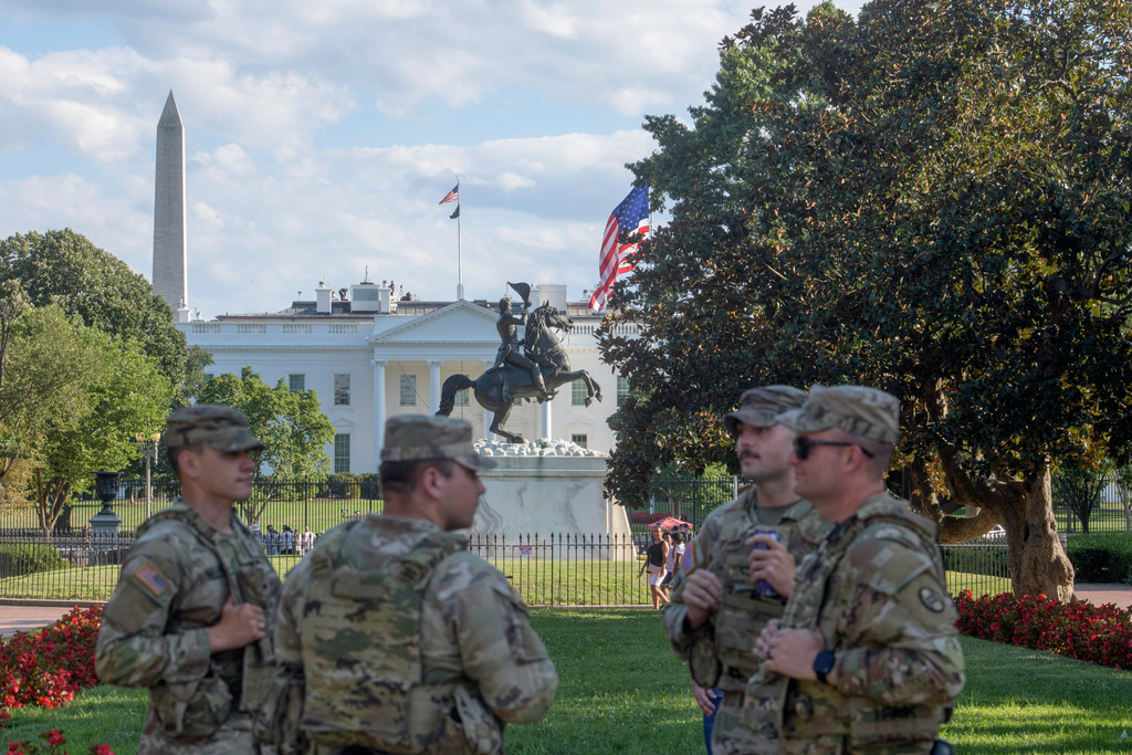 With the White House in the distance, members of the South Carolina National Guard patrol Lafayette Park in Washington, Monday, Aug. 25, 2025. (AP Photo/Rod Lamkey, Jr.)