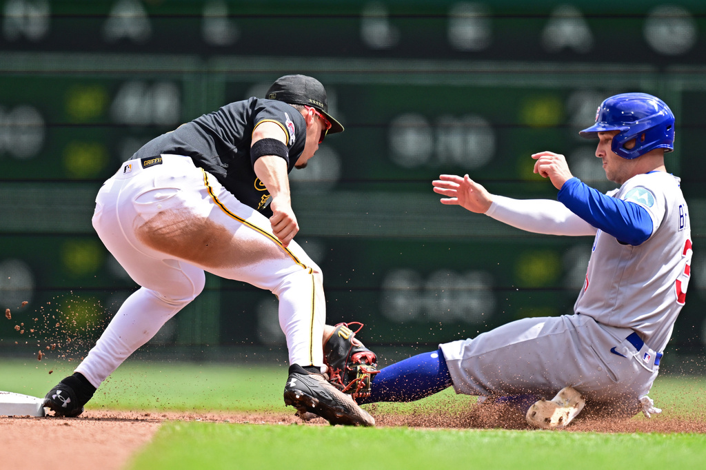 Pittsburgh Pirates shortstop Konnor Griffin tags out Chicago Cubs' Alex Bregman at second base on a steal attempt during the fifth inning of a baseball game, Monday, May 25, 2026, in Pittsburgh. (AP Photo/David Dermer)