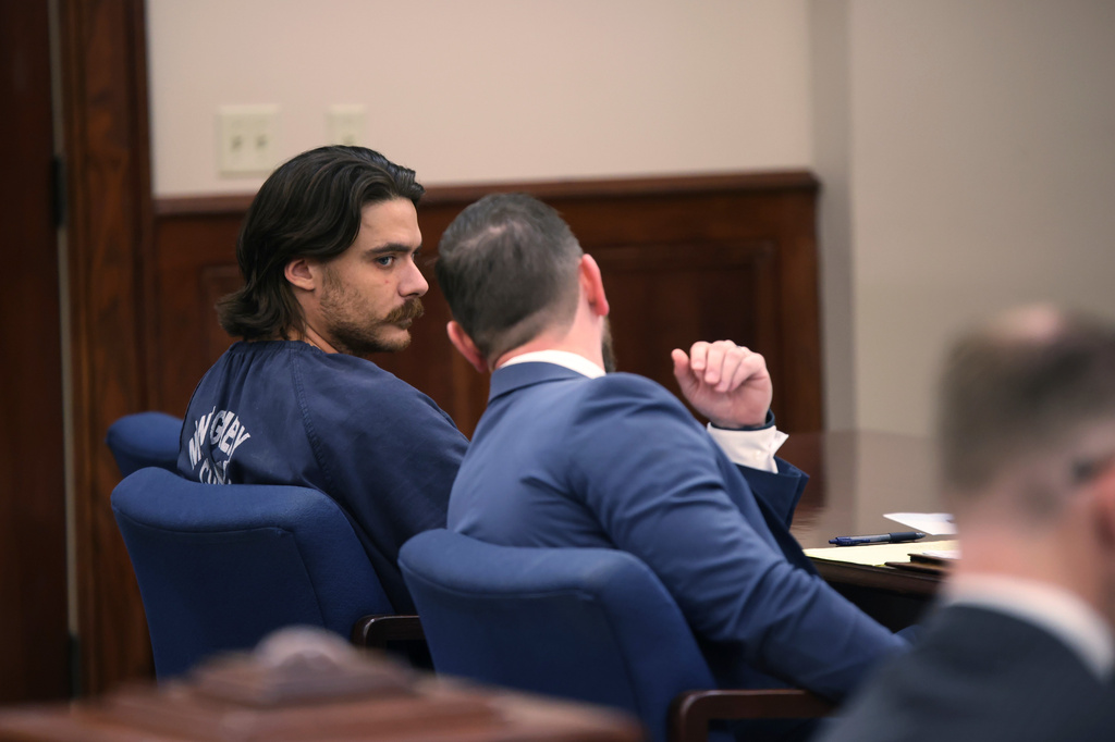 Dalton Eatherly, who goes by the moniker Chud the Builder, speaks with attorney Jacob Fendley during a hearing at the Montgomery County Courthouse, Thursday, May 21, 2026, in Clarksville, Tenn. (AP Photo/Adin Parks)