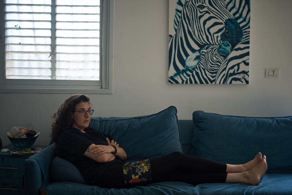 Israeli-Russian doctoral researcher from Princeton University, Elizabeth Tsurkov, who was kidnapped in Iraq, in 2023 and released last September, sits on a sofa during an interview in Ramat Gan, Israel, on Nov. 6, 2025. (AP Photo/Leo Correa)