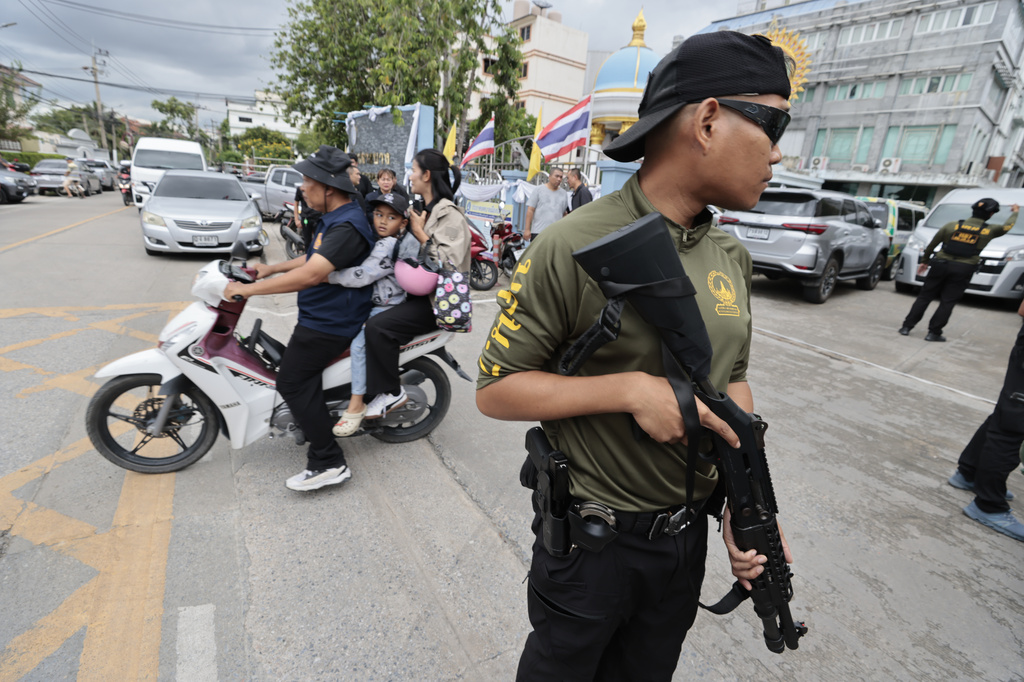 Security officers secure the area after a shooting incident at the Debsirin Nonthaburi School in Thailand's Nonthaburi province, Friday, Aug. 7, 2026. (AP Photo/Wason Wanichakorn)
