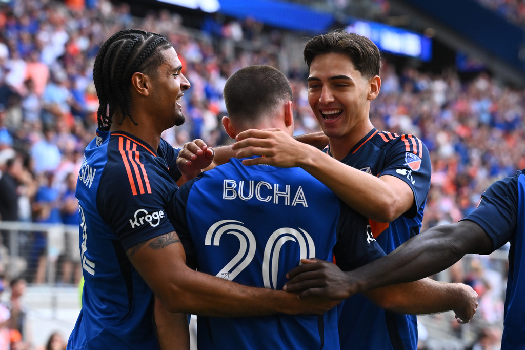 FC Cincinnati' Pavel Bucha, center, celebrates his first half goal with Miles Robinson, left, and Gerardo Valenzuela, right, during a match against Vancouver Whitecaps FC in Cincinnati, Wednesday, July 22, 2026. (AP Photo/Ben Jackson)