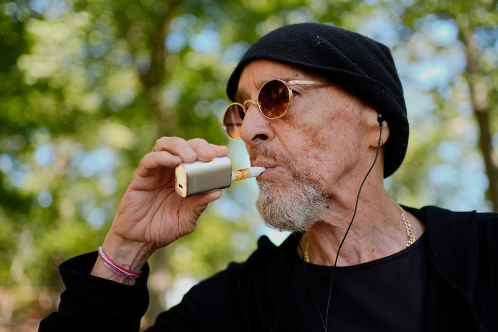 Miguel Laboy, a daily cannabis user, vapes, Friday, Oct. 3, 2025, in Brookline, Mass. (AP Photo/Robert F. Bukaty)