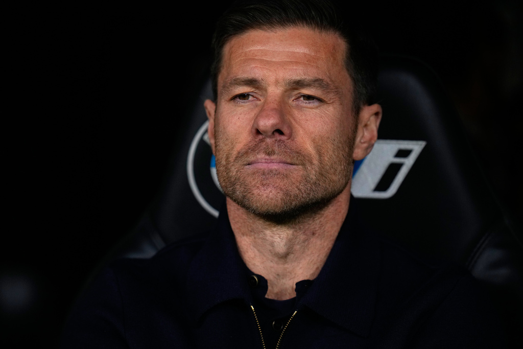 Real Madrid's head coach Xabi Alonso takes his seat on the bench before the Spanish La Liga soccer match between Real Madrid and Celta Vigo in Madrid, Spain, Sunday, Dec. 7, 2025. (AP Photo/Manu Fernandez)