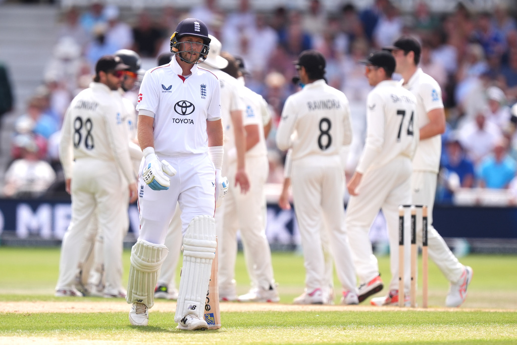 England's Joe Root, foreground, reacts after being bowled out by New Zealand's Nathan Smith via lbw during day three of the Third Test cricket match between England and New Zealand, in Nottingham, England, Saturday June 27, 2026. (Mike Egerton/PA via AP)