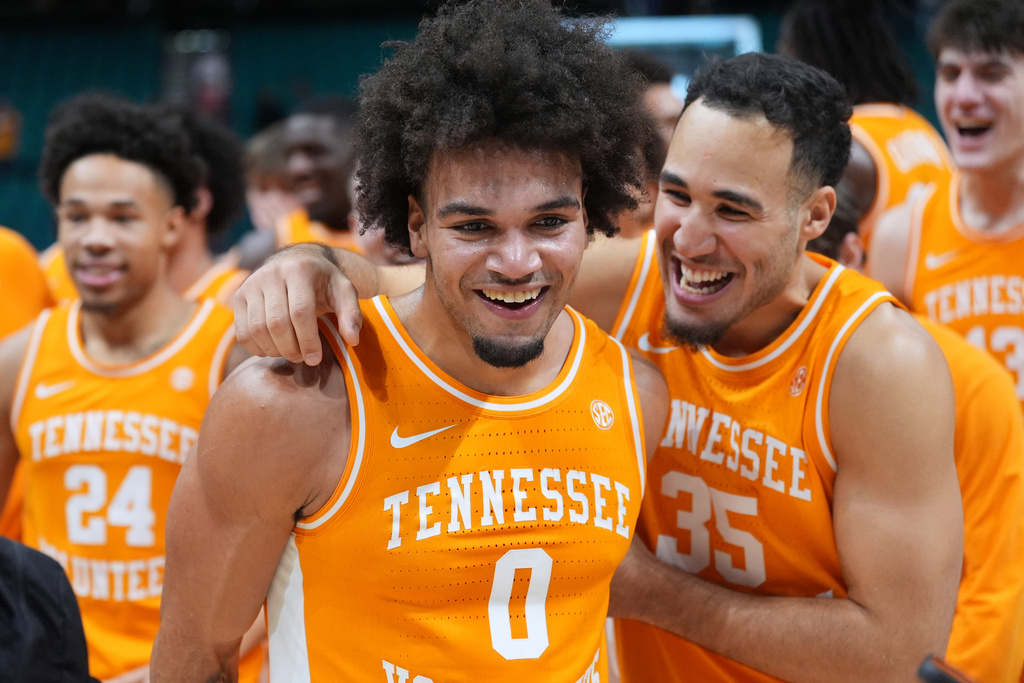 Tennessee guard Ja'Kobi Gillespie (0) and guard Ethan Burg (35) celebrate after Tennessee defeated Houston in an NCAA college basketball game in the Players Era tournament Las Vegas, Tuesday, Nov. 25, 2025. (AP Photo/Eric Gay)