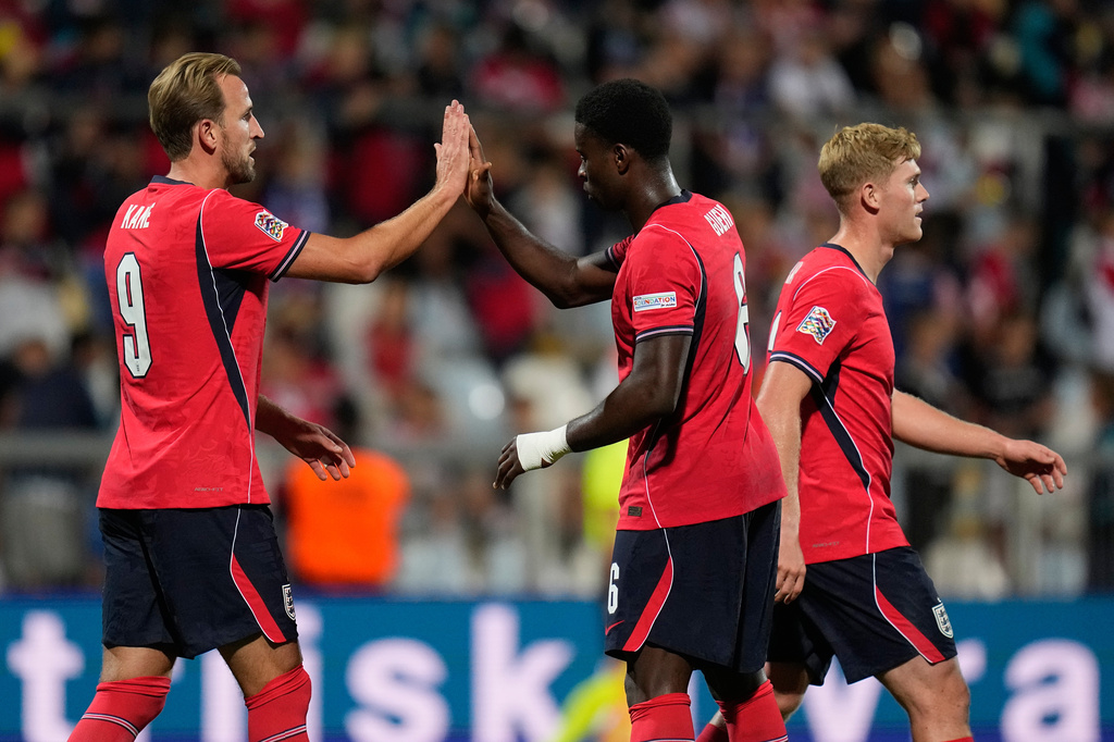 England's Harry Kane, left, and Marc Guehi reacts after the fifth goal during the Nations League soccer match between Croatia and England in Rijeka, Croatia, Saturday, Oct. 3, 2026. (AP Photo/Darko Bandic)