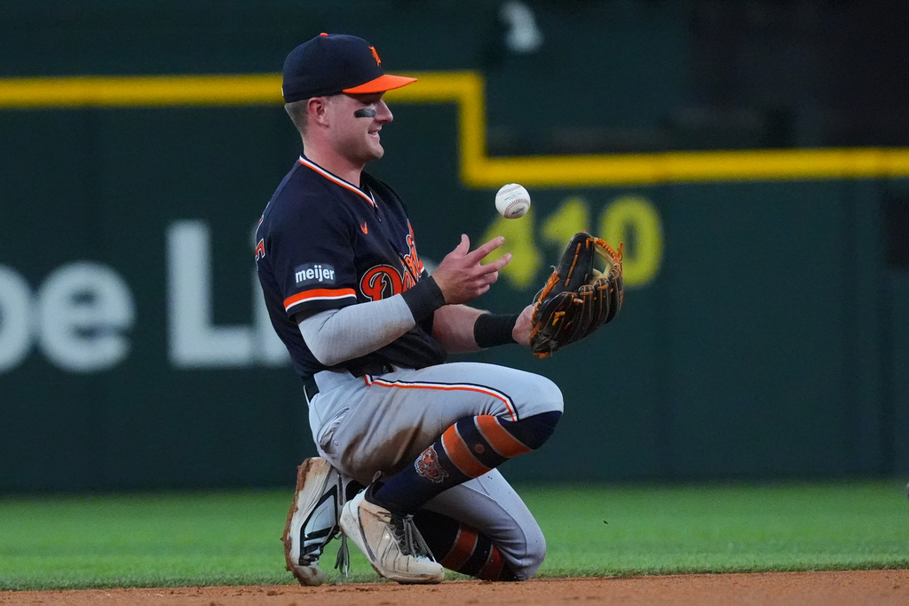 Detroit Tigers shortstop Kevin McGonigle tosses the ball to himself after catching a line drive out against Texas Rangers' Elias Díaz during the second inning of a baseball game, Sunday, July 5, 2026, in Arlington, Texas. (AP Photo/LM Otero)
