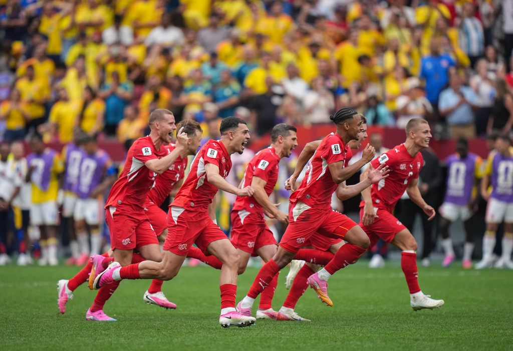 Switzerland players celebrate after defeating Colombia in a penalty shootout in the World Cup round of 16 soccer match between Switzerland and Colombia in Vancouver, British Columbia, Tuesday, July 7, 2026. (Darryl Dyck/The Canadian Press via AP)