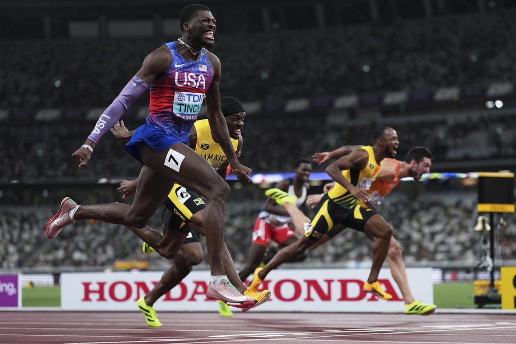 United States' Cordell Tinch, foreground, wins the men's 110 meters hurdles final at the World Athletics Championships in Tokyo, Tuesday, Sept. 16, 2025. (AP Photo/Bernat Armangue)