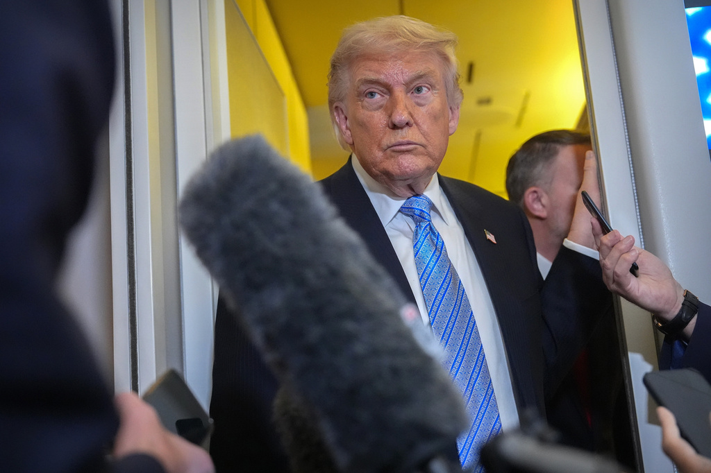 FILE - President Donald Trump speaks to reporters aboard Air Force One, May 15, 2026, as he returns from a trip to Beijing, China. (AP Photo/Mark Schiefelbein, File)