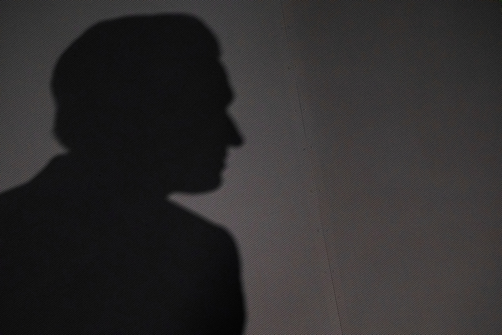 California Gov. Gavin Newsom casts a shadow as he hosts a press conference and signs a slew of climate initiative bills at the Academy of Sciences, Friday, Sept. 19, 2025, in San Francisco. (AP Photo/Camille Cohen)