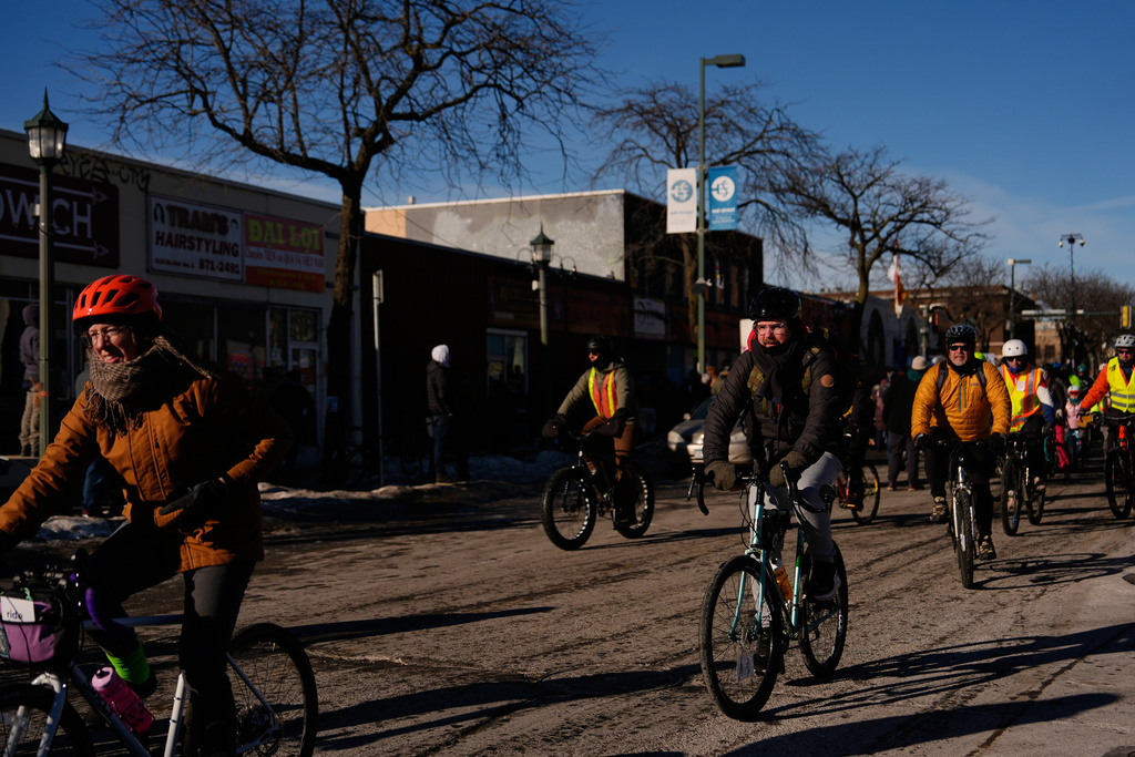 People gather for a solidarity bike ride for Alex Pretti and Renee Good on Saturday, Jan. 31, 2026 in Minneapolis. (AP Photo/Julia Demaree Nikhinson)