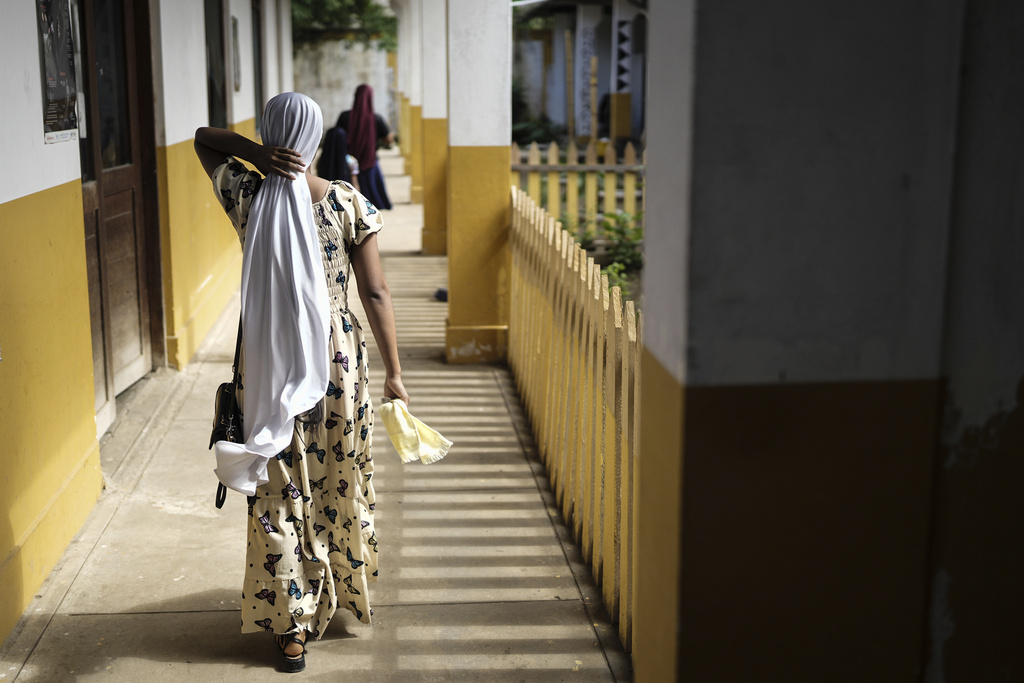 A woman walks through a health center in Santa Rosa, Peru, an island on the Amazon River on the border with Colombia, Monday, Aug. 18, 2025. (AP Photo/Ivan Valencia)