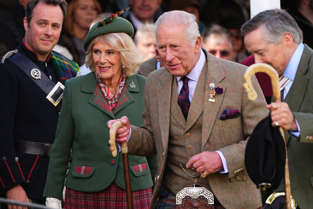 Britain's King Charles III and Queen Camilla walk, during the Braemar Gathering highland games at the Princess Royal and Duke of Fife Memorial Park, in Aberdeenshire, Scotland, Saturday, Sept. 5, 2026. (Aaron Chown/PA via AP)