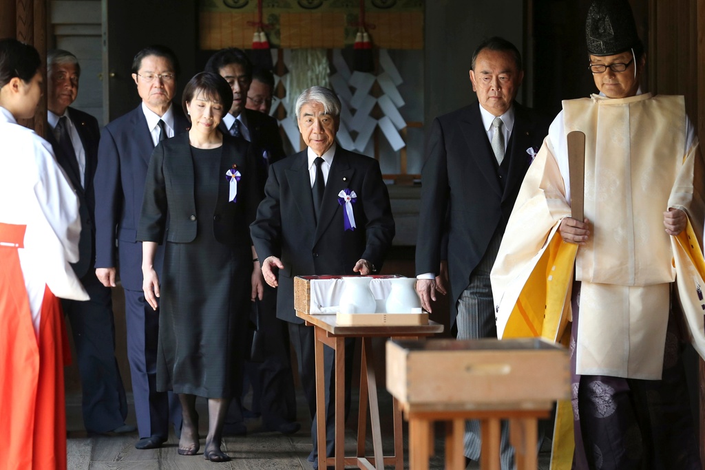 FILE - Japanese lawmakers, including Sanae Takaichi, center left, visit the Yasukuni Shrine to pay respect to the war dead on the day of the 69th anniversary of the end of the World War II, in Tokyo, on Aug. 15, 2014. (AP Photo/Koji Sasahara, File)