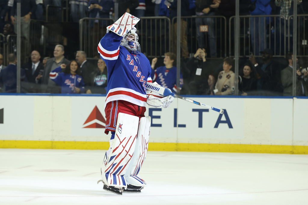 New York Rangers goaltender Igor Shesterkin reacts after scoring a goal during the third period of an NHL hockey game against the Tampa Bay Lightning Thursday, Oct. 1, 2026, in New York. (AP Photo/Pamela Smith)