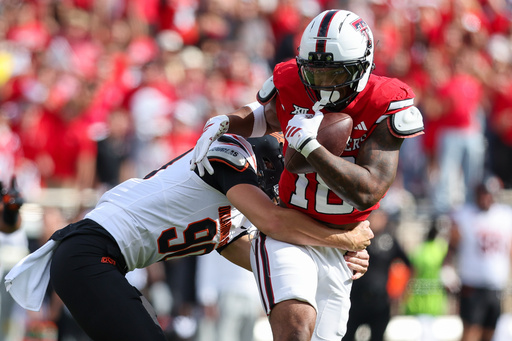 Texas Tech wide receiver Roy Alexander, right, is tackled after catching a blocked punt during the first half of an NCAA college football game against Oklahoma State, Saturday, Oct. 25, 2025, in Lubbock, Texas. (AP Photo/Chase Seabolt) Texas Tech wide receiver Roy Alexander, right, is tackled after catching a blocked punt during the first half of an NCAA college football game against Oklahoma State, Saturday, Oct. 25, 2025, in Lubbock, Texas. (AP Photo/Chase Seabolt)