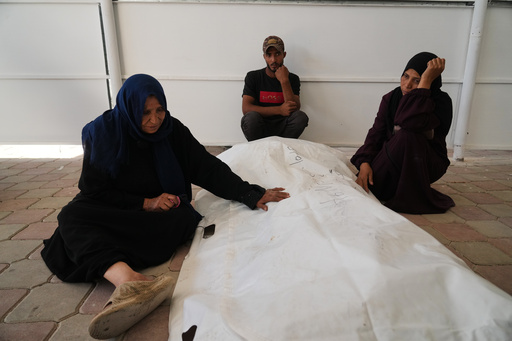 Dhuhra Zughra reacts beside the body of her son, Muhammad Zughra, after his remains were identified following his disappearance on Oct. 7, 2023, at Nasser Hospital in Khan Younis, Gaza Strip, Saturday, Oct. 18, 2025. (AP Photo/Abdel Kareem Hana) Dhuhra Zughra reacts beside the body of her son, Muhammad Zughra, after his remains were identified following his disappearance on Oct. 7, 2023, at Nasser Hospital in Khan Younis, Gaza Strip, Saturday, Oct. 18, 2025. (AP Photo/Abdel Kareem Hana)