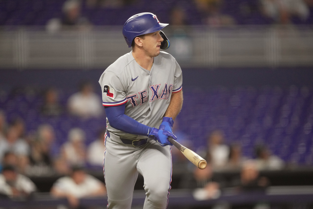 Texas Rangers Wyatt Langford (36) watches his solo home run against the Miami Marlins in the fourth inning of a baseball game, Wednesday, June 24, 2026, in Miami. (AP Photo/Jim Rassol)