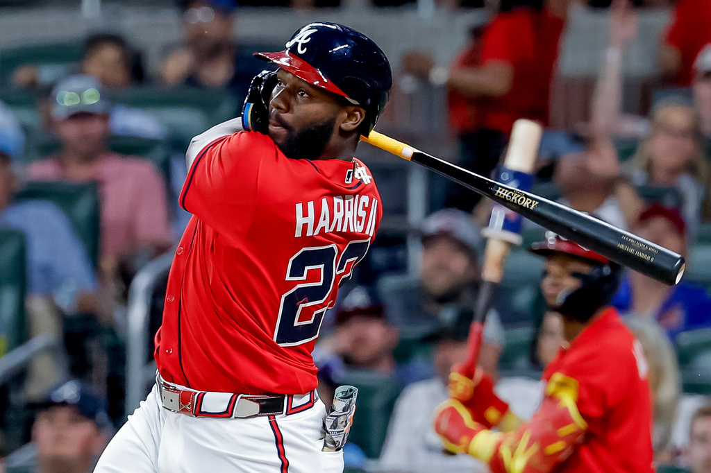 Atlanta Braves pinch hitter Michael Harris II (23) follows through on a two-RBI double against the Philadelphia Phillies during the sixth inning of a baseball game, Friday, April 24, 2026, in Atlanta. (AP Photo/Erik S. Lesser)