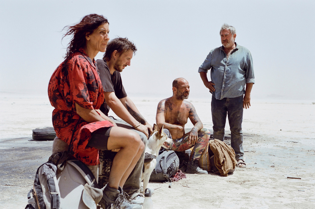 This image released by Neon shows, from left, Stefania Gadda, Joshua Liam Herderson, Richard Bellamy and Sergi López in a scene from the film "Sirat." (Neon via AP)