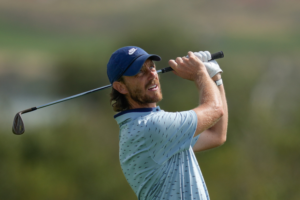 Tommy Fleetwood of England watches his shot from the 3rd fairway during the third round of the Abu Dhabi Golf Championship in Abu Dhabi, United Arab Emirates, Saturday, Nov. 8, 2025. (AP Photo/Altaf Qadri)