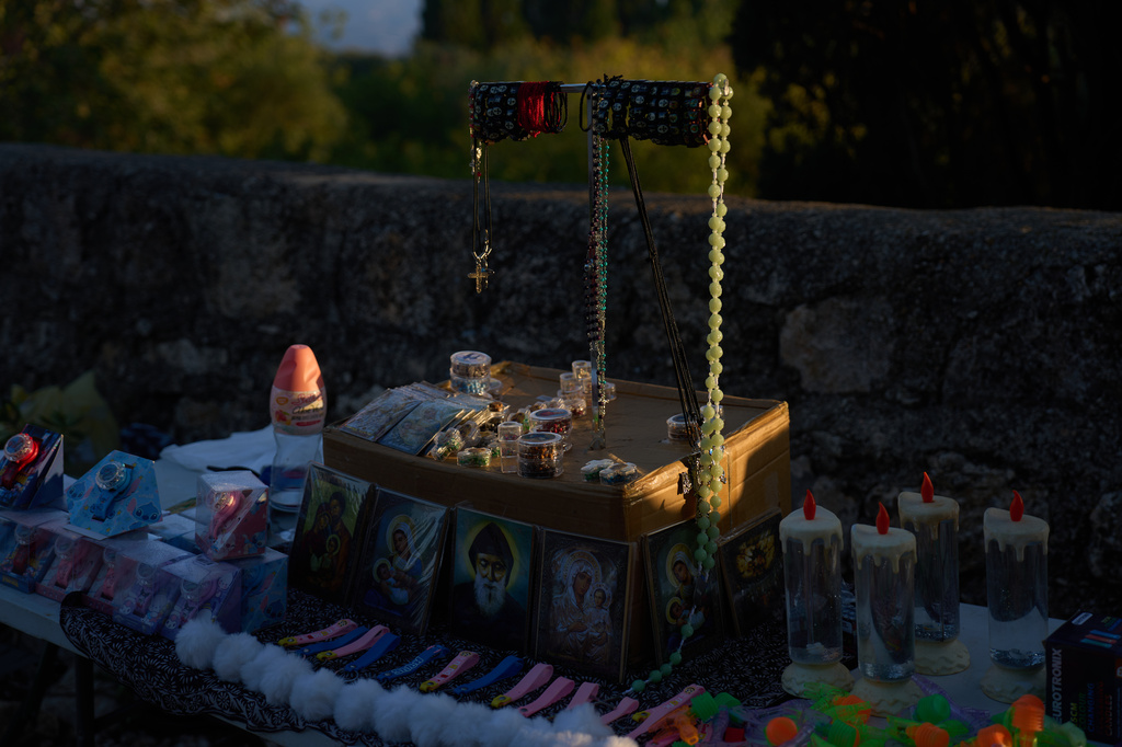 Religious souvenirs for sale are placed on a stand for Christian pilgrims who climb to the Basilica of the Transfiguration on Mount Tabor, northern Israel, on Aug. 6, 2026. (AP Photo/Ariel Schalit)