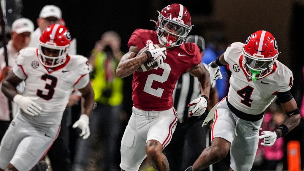Alabama running back Dre Washington (20) runs against Georgia during the first half of a Southeastern Conference championship NCAA college football game, Saturday, Dec. 6, 2025, in Atlanta. (AP Photo/Mike Stewart)