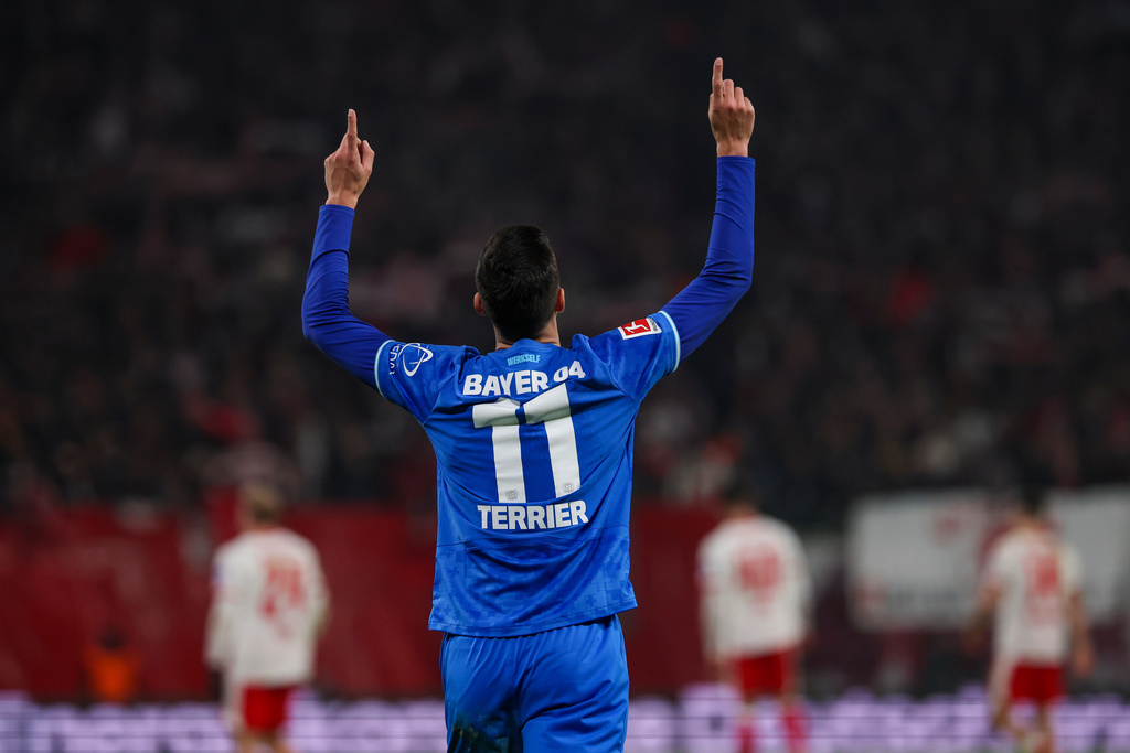 Leverkusen's Martin Terrier celebrates after scoring during the Bundesliga soccer match between RB Leipzig and Bayer Leverkusen, in Leipzig, Germany, Saturday Dec. 20, 2025. (Jan Woitas/dpa via AP)