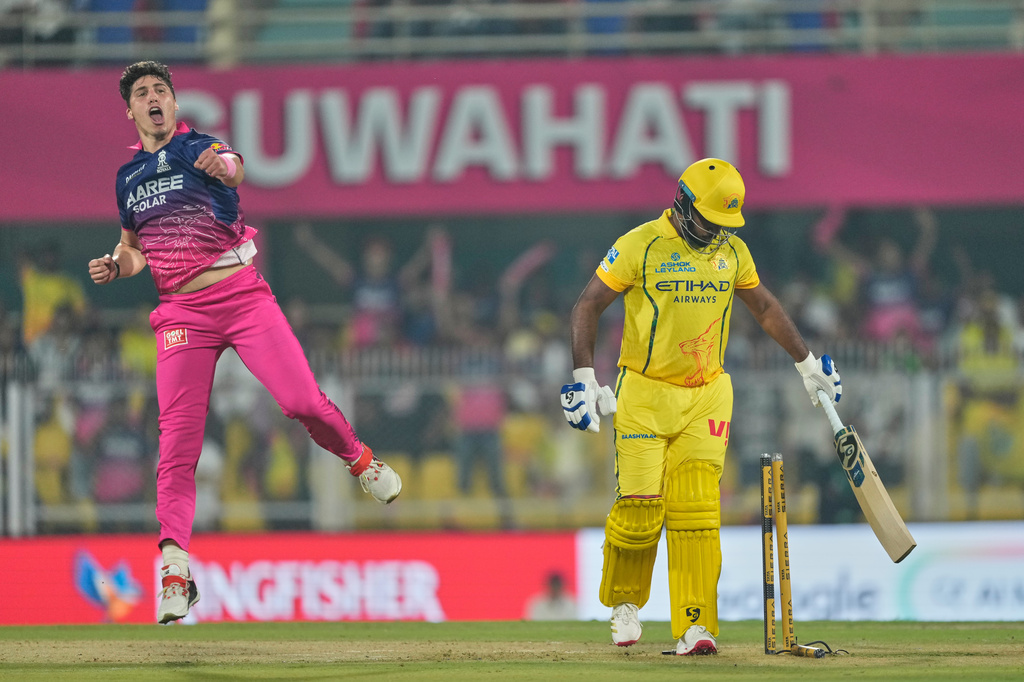 Rajasthan Royals's Nandre Burger, left, celebrates the wicket of Chennai Super Kings' Sanju Samson during the Indian Premier League cricket match between Chennai Super Kings and Rajasthan Royals in Guwahati, India, Monday, March 30, 2026. (AP Photo/Anupam Nath)