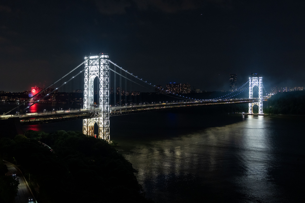 The George Washington Bridge's two towers are lit ahead of America's 250th birthday, Monday, June 29, 2026, in New York. (AP Photo/Adam Gray)