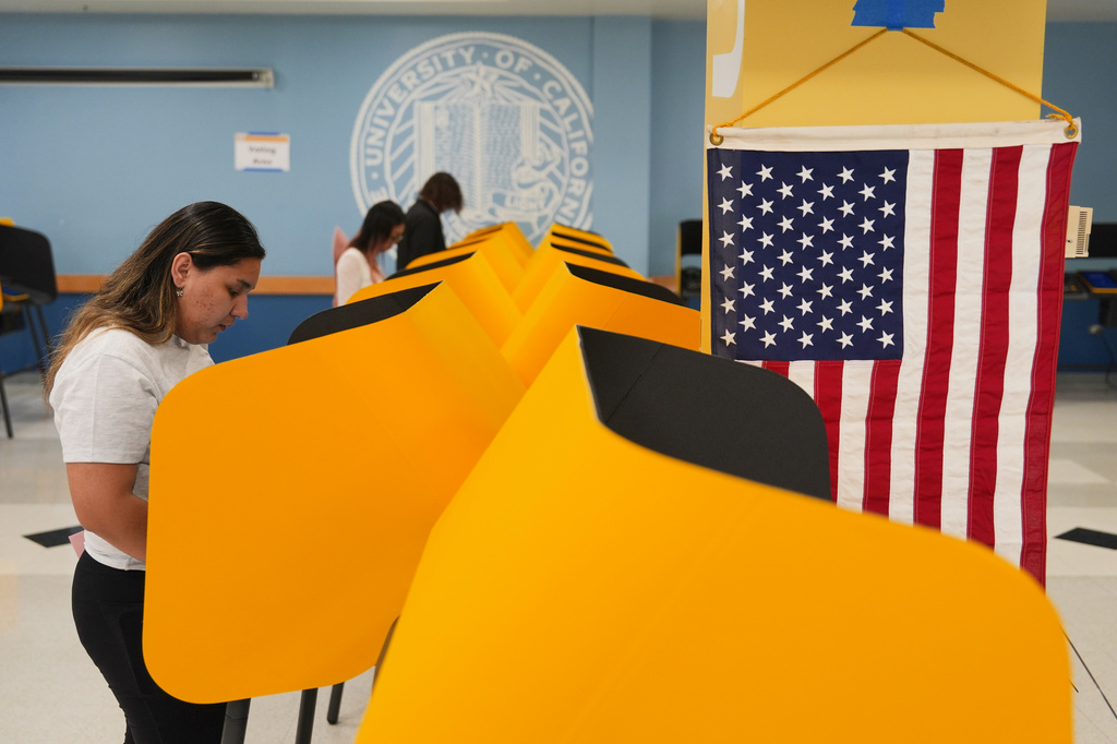 FILE - Voters cast their ballots at a voting center on the UCLA campus, June 2, 2026, in Los Angeles. (AP Photo/Jae C. Hong, File)