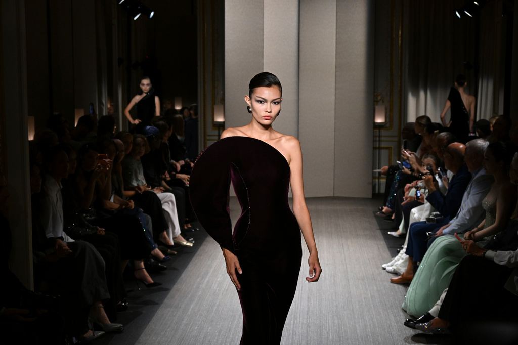 A model wears a creation as part of the Giorgio Armani Privé Haute Couture Fall/Winter 2026-2027 Women's collection presented in Paris, Tuesday, July 7, 2026. (AP Photo/Emma Da Silva)
