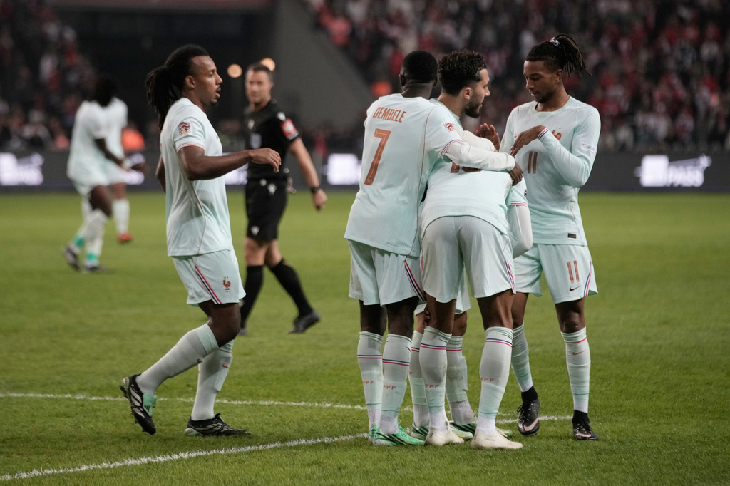 French players stand around Kylian Mbappe after he scored and injured himself during the UEFA Nations League soccer match between Turkey and France in Izmit, Turkey, Friday, Sept. 25, 2026. (AP Photo/Khalil Hamra)