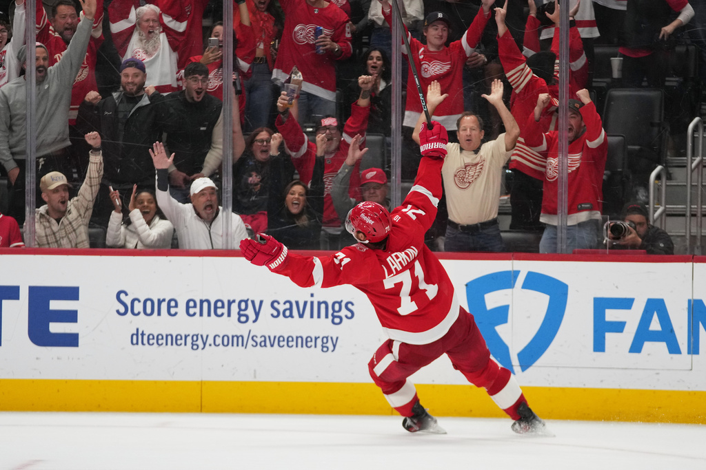 Detroit Red Wings center Dylan Larkin (71) celebrates his goal against the Tampa Bay Lightning during overtime in an NHL hockey game Friday, Oct. 17, 2025, in Detroit. (AP Photo/Paul Sancya)