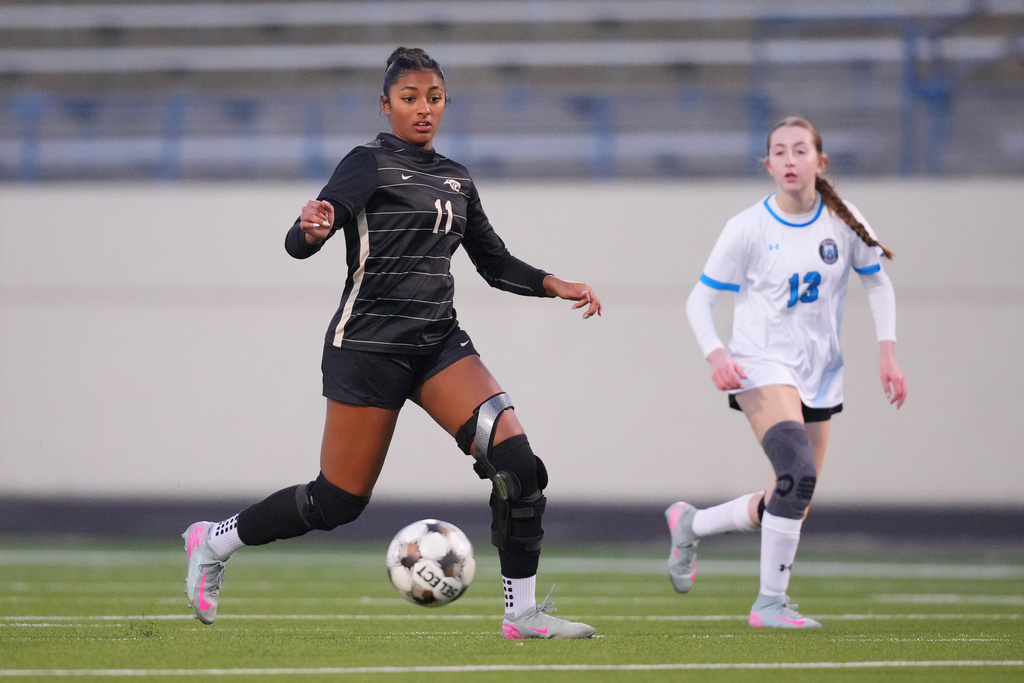 Plano East varsity soccer player Aliya Jacob, left, controls the ball against Rock Hill's Hanna Schinner during a soccer game, Jan. 30, 2026, in Murphy, Texas. (AP Photo/Julio Cortez)