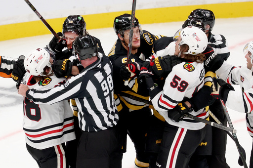 Boston Bruins and Chicago Blackhawks players fight during the third period of an NHL hockey game, Thursday, Oct. 9, 2025, in Boston. (AP Photo/Mark Stockwell) Boston Bruins and Chicago Blackhawks players fight during the third period of an NHL hockey game, Thursday, Oct. 9, 2025, in Boston. (AP Photo/Mark Stockwell)