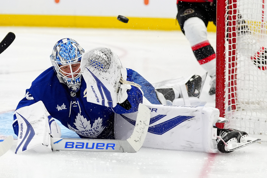 Ottawa Senators right wing Drake Batherson scores on Toronto Maple Leafs goaltender Joseph Woll during the third period of an NHL hockey game in Toronto, Saturday, Dec. 27, 2025. (Frank Gunn/The Canadian Press via AP)