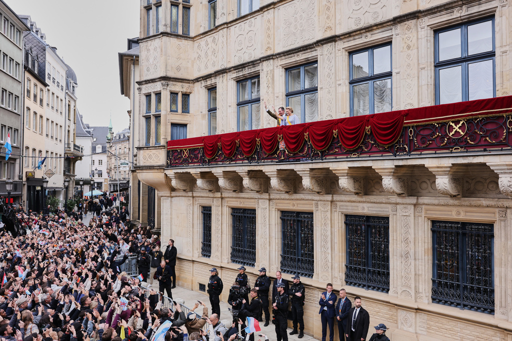 Luxembourg's Grand Duke Guillaume and Luxembourg's Grand Duchess Stephanie wave from the balcony of the Grand Ducal Palace in Luxembourg, Friday, Oct. 3, 2025. (AP Photo/Omar Havana)