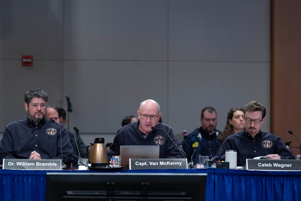 National Transportation Safety Board (NTSB) investigators William Bramble, from left, Captain Van McKenny and Caleb Wagner speak during the hearing on the midair aircraft collision that killed 67 people near Washington Reagan National Airport, in Washington, Tuesday, Jan. 27, 2026. (AP Photo/Jose Luis Magana)