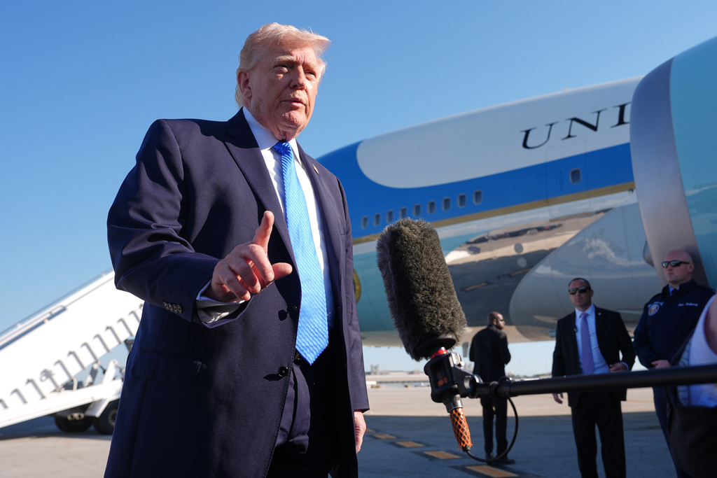 President Donald Trump speaks with the media before boarding Air Force One, Monday, March 23, 2026, at Palm Beach International Airport in West Palm Beach, Fla. (AP Photo/Mark Schiefelbein)