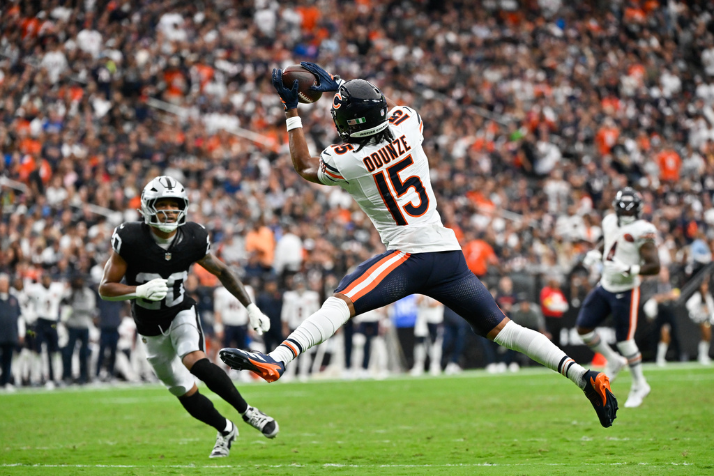 Chicago Bears wide receiver Rome Odunze (15) makes a catch to score a touchdown during the second half of an NFL football game against the Las Vegas Raiders Sunday, Sept. 28, 2025, in Las Vegas. (AP Photo/David Becker)